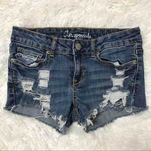Cut off distressed denim shorts